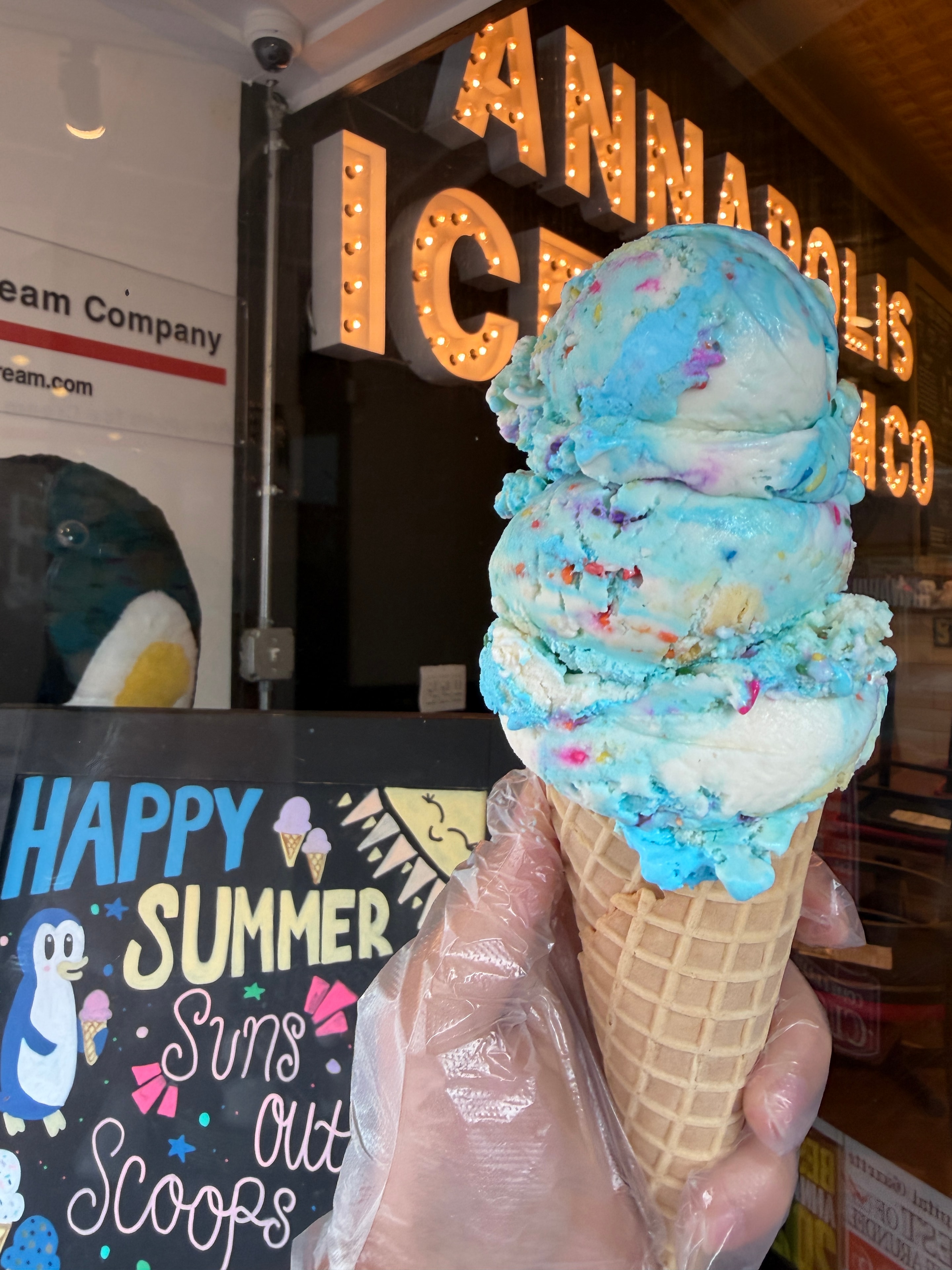 Colorful ice cream cone with multiple scoops